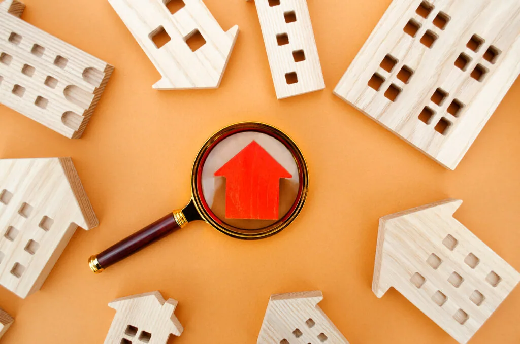 magnifying glass wooden houses house searching concept home appraisal scaled
